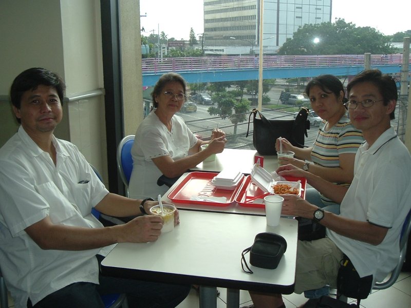 Kuya, Mommy, Vi, and Me at a Jollibee restaurant on Quezon Blvd.